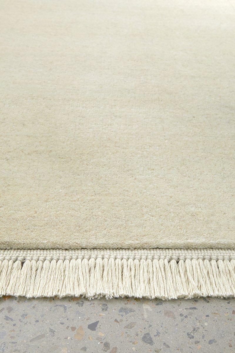 Hand-Loomed Cream Tassel Wool Rug - Lost Design Society