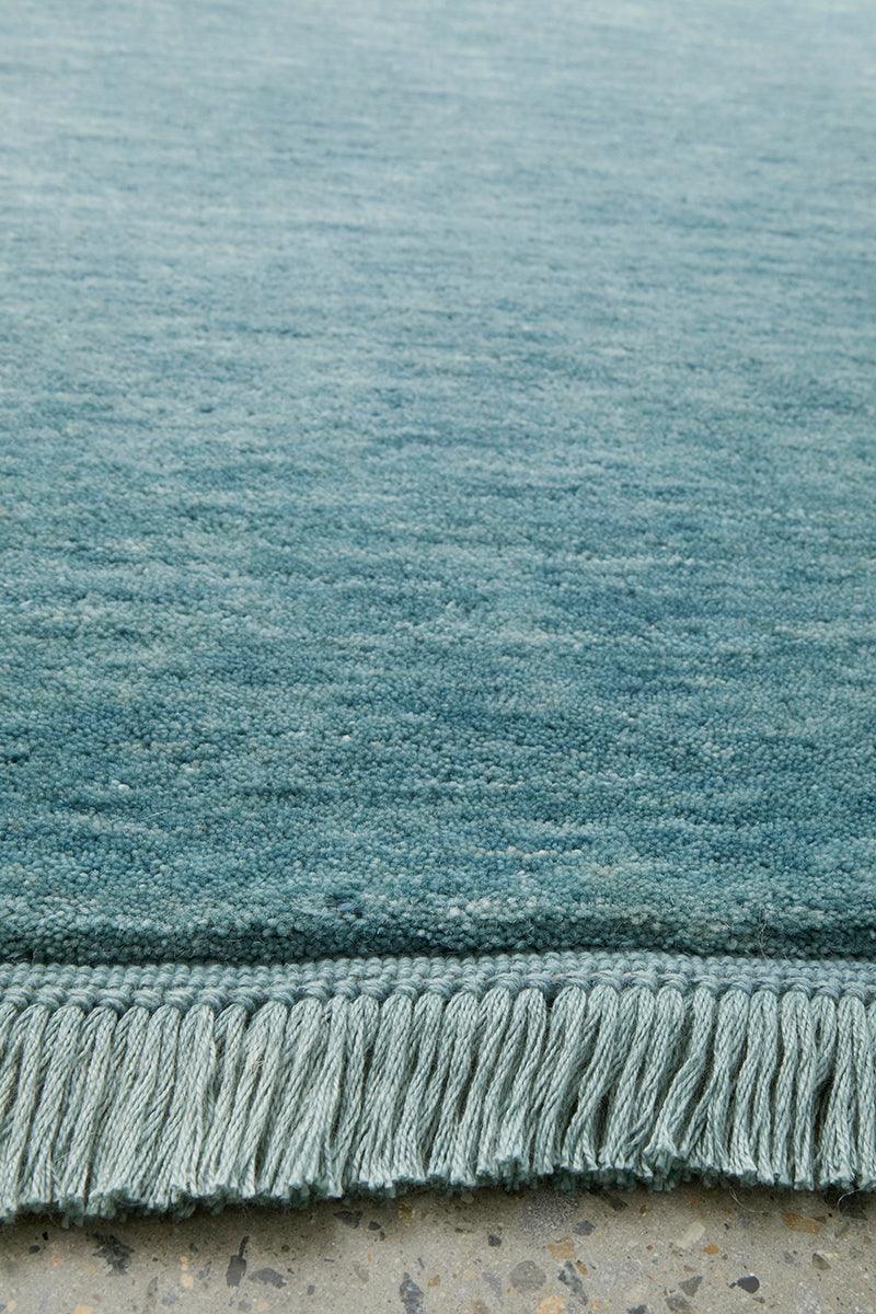 Hand-Loomed Sky Blue Tassel Wool Rug
