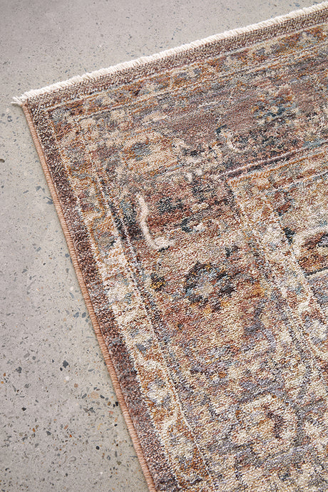 Close-up of a textured area rug on a concrete floor