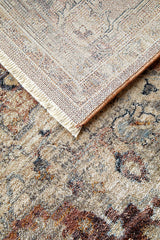 Close-up of a patterned rug with a visible border.