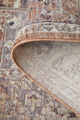 Close-up of a patterned rug with a focus on the edge.